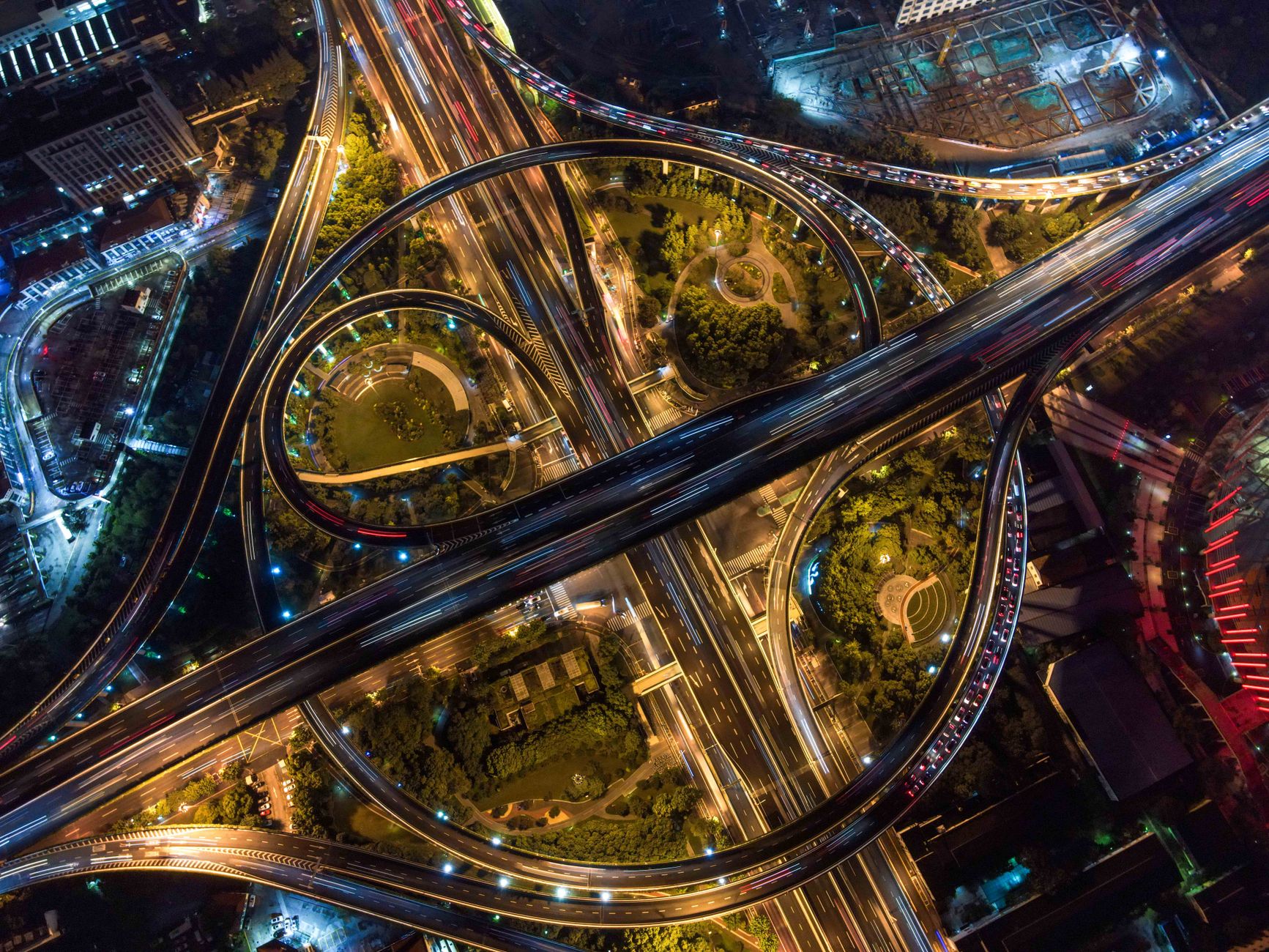Multi-lane expressway interchange at night, representative of the Ahmedabad-Dholera Expressway