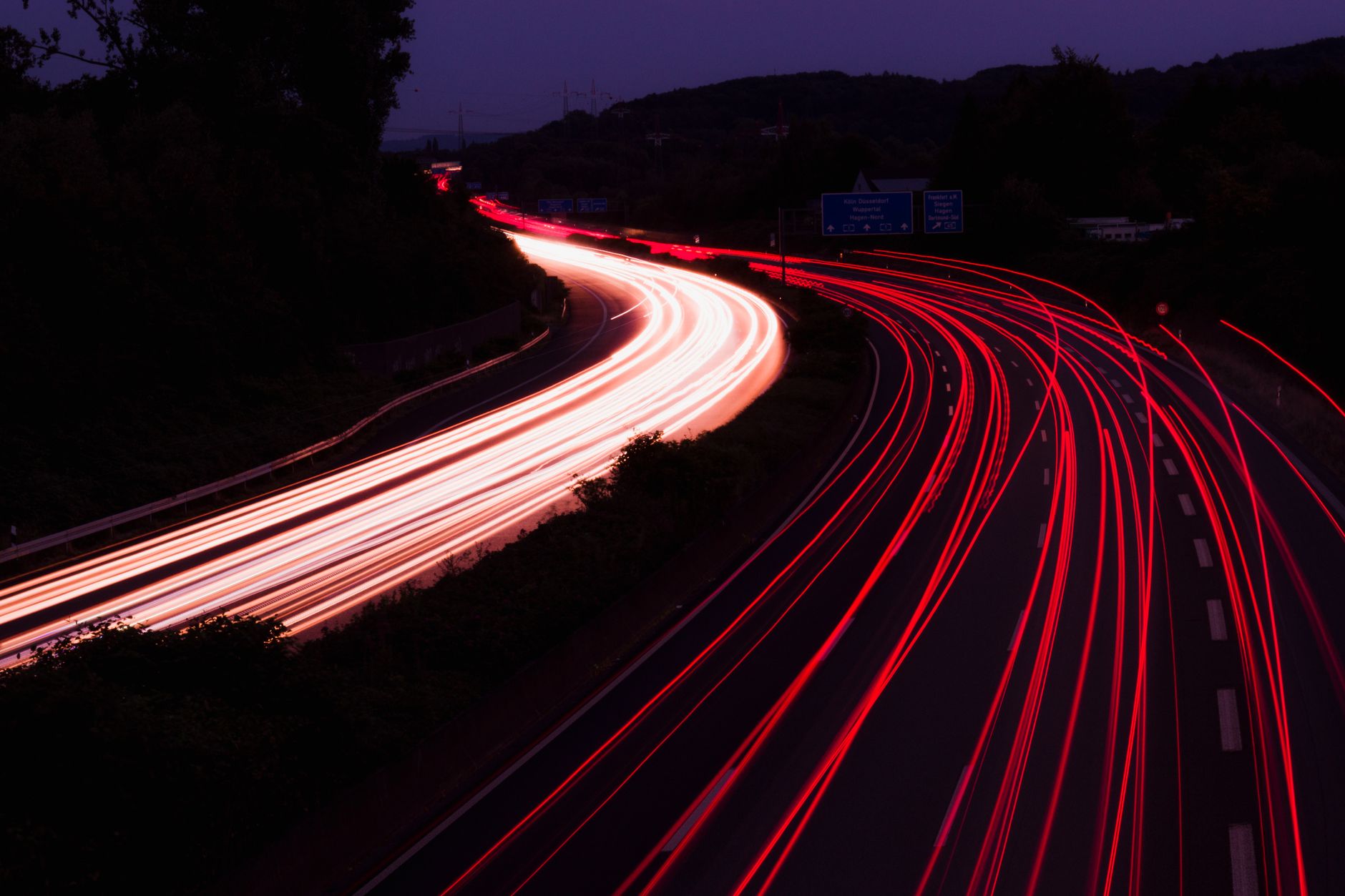 Highway with light trails at night, representative of the route to Dholera